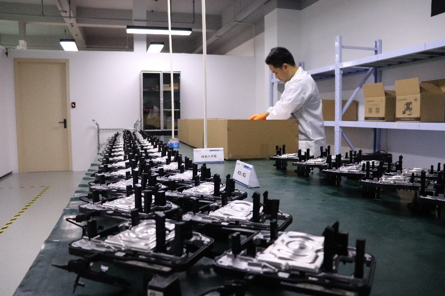 Worker boxing finished parts at the PICO Changshu packing bench
